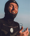 Man in wet suit at the beach with tuff stuff zinc sunscreen on his face