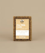 Oat milk latte soap with recycled paper brown and white tag held to the soap by a metal push pin 