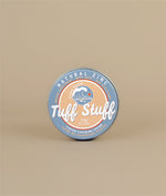 Zinc sunscreen metal packaging with with blue and orange colours with a wave logo and the words Tuff Stuff