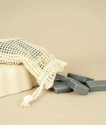 Meshed soap saver bag dumping dumping small cut offs of aloe mint soap