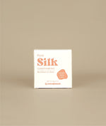 White with pink writing small square floral silk conditioner bar packaging