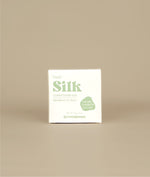 White with green writing small square fresh silk conditioner bar packaging