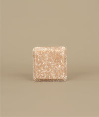 Small square naked pink shampoo bar