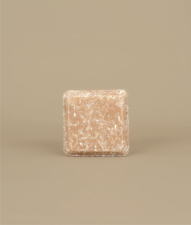 Small square naked pink shampoo bar