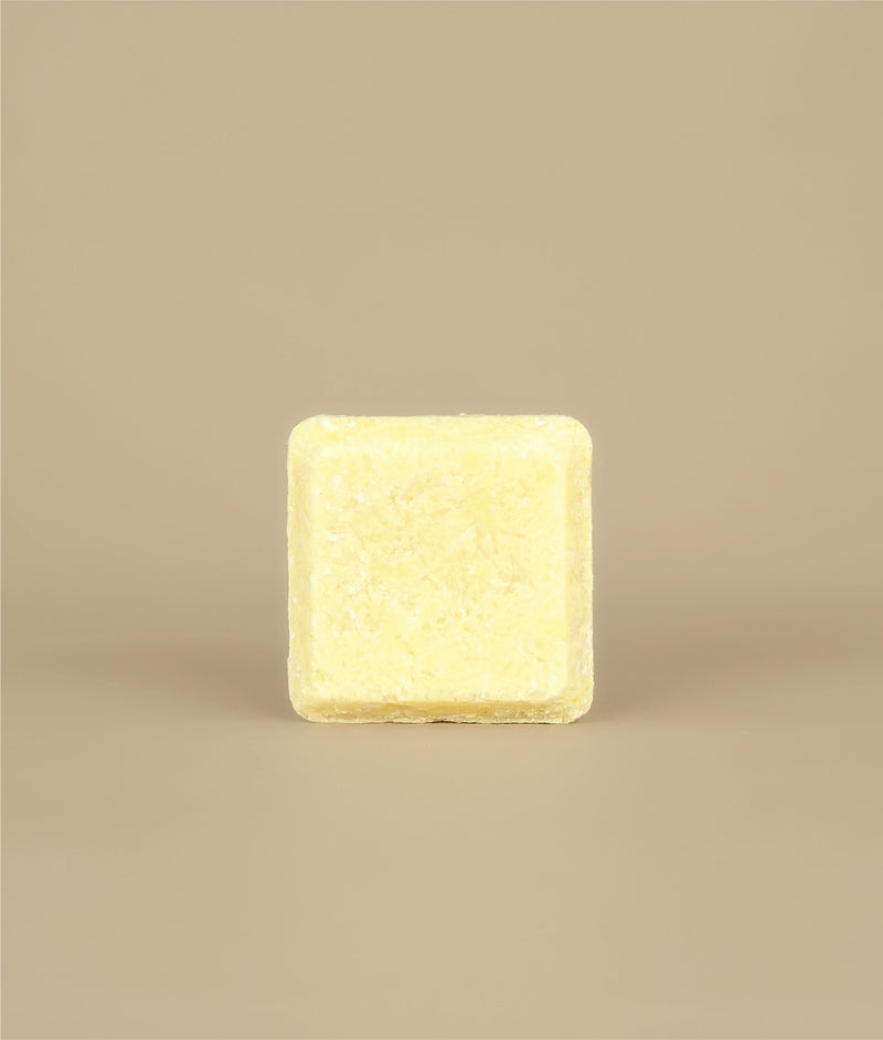 Small square naked yellow sunny shampoo bar