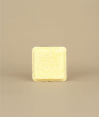 Small square naked yellow sunny shampoo bar