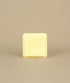 Small square naked yellow sunny shampoo bar